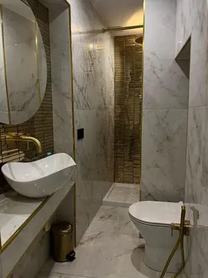 a bathroom with a sink and a toilet and a mirror at Ai Chiavettieri Suite in Palermo
