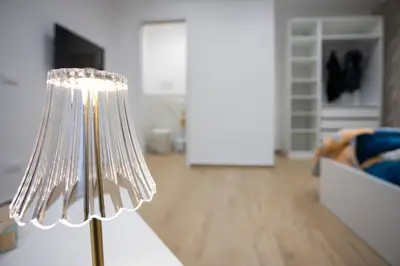 a silver lamp in a living room with a couch at Dominic Luxury House - a 2 passi dalla cattedrale in Palermo