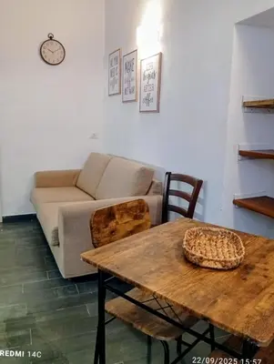 a living room with a couch and a table at Sicily Bed' House in Palermo