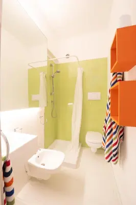 a bathroom with a shower and a sink and a toilet at La Bougainvillea casa vacanze in Alcamo