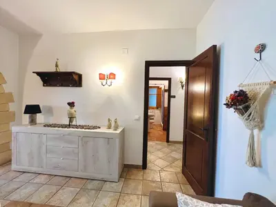 a living room with a dresser and a mirror at Villa Ólea Resort in Carini