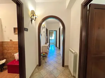 a hallway with an archway in a house at Villa Ólea Resort in Carini