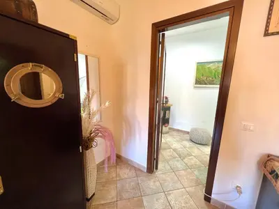 a hallway with a door leading to a room at Villa Ólea Resort in Carini