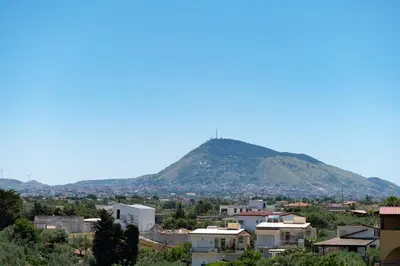 a city with a mountain in the background at Villa Stella in Alcamo