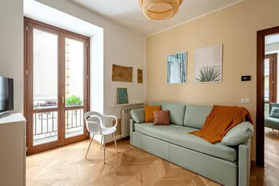 a living room with a couch and a chair at Casa Dolce Vita by Wonderful Italy in Palermo