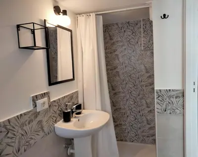 a bathroom with a sink and a shower at Casa Nadir in Palermo