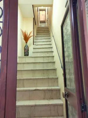 a set of stairs with a vase sitting on top at Casa Nadir in Palermo