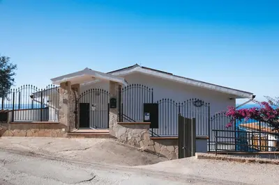 a house with a gate in front of it at Trabia Villa Bedda Mia B in Trabia