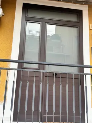a front door of a house with a balcony at Casa Sulia in Terrasini