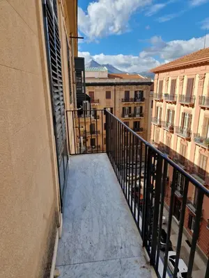 a balcony with a view of some buildings at CapoMassimo in Palermo