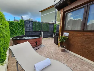 a patio with a table and a fire pit at la casetta del baglio in Monreale