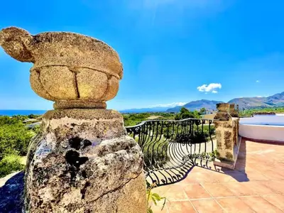 a stone statue of a bear on top of a building at History and Art Casa Bellacera in Casteldaccia