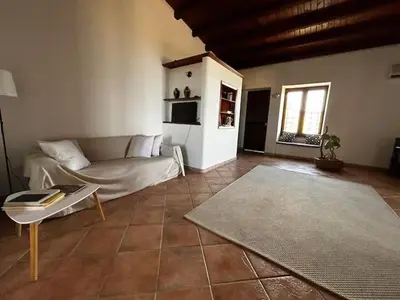 a living room with a couch and a table at History and Art Casa Bellacera in Casteldaccia
