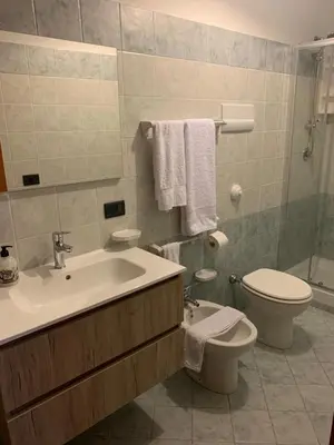 a bathroom with a sink and a toilet at Casa Ponticello in Termini Imerese