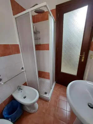 a bathroom with a shower and a toilet and a sink at Il Rifugio Delle Giuiuzze in Palermo