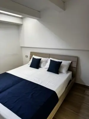 a bathroom with a toilet and a sink at Terrasini Center Apartments in Terrasini