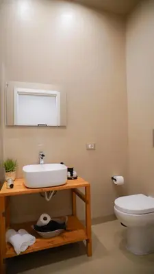 a bathroom with a sink and a toilet at Marina Sea Apartments-Seaside Boutique in Palermo