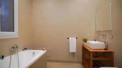 a bathroom with a bath tub and a sink at Marina Sea Apartments-Seaside Boutique in Palermo