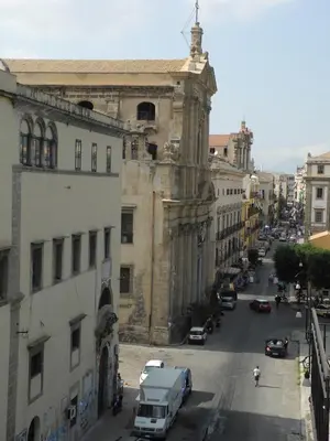 a view of a city street with cars and buildings at Kalsa Apartment in Palermo