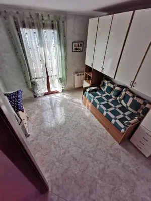 a bedroom with a bed and a large window at Località Cefalù - Villa indipendente con giardino in Lascari