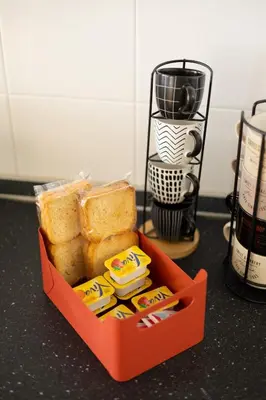 a box of bread and butter on a counter at Clar Suite -Grattacielo in Palermo