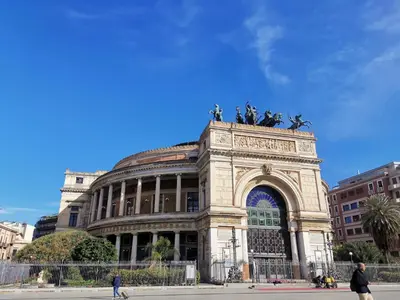 a building with a statue on top of it at Primo Piano in Palermo