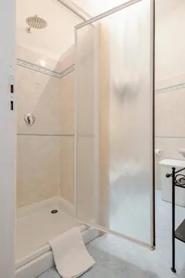 a shower with a glass door in a bathroom at Villa Disa by Sicily Travelling Villas in Castellammare del Golfo