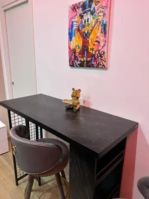 a black table with a teddy bear sitting on top at Sweet dreams in Palermo