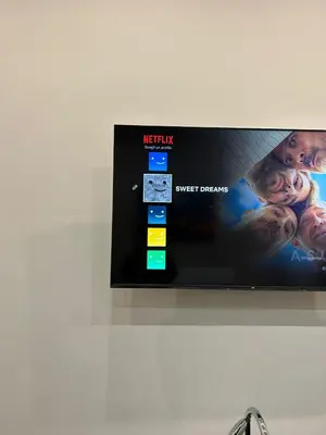 a flat screen tv hanging on a wall at Sweet dreams in Palermo