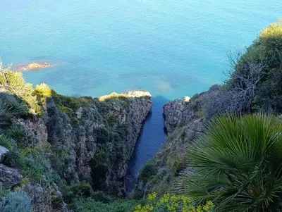 an aerial view of the ocean between two cliffs at Guarda l'alba in Altavilla Milicia
