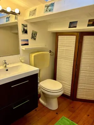 a bathroom with a toilet and a sink at Casa Vacanze Sfera 6 in Palermo
