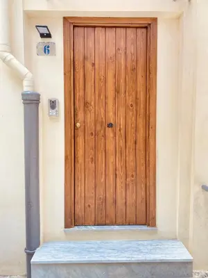 a wooden door on the side of a building at Casa Vacanze Sfera 6 in Palermo