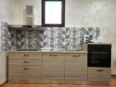 a kitchen with a sink and a stove at Maison Cattedrale - Proppro SRL - Palermo in Palermo
