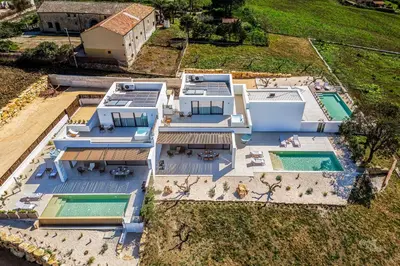 an aerial view of a house with two swimming pools at Villa Brezza in Partinico