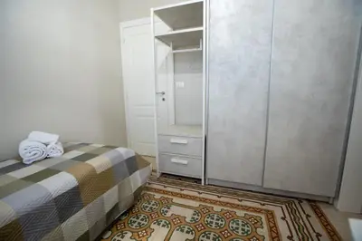 a bedroom with a bed with two pillows on it at Casa del Porto in Castellammare del Golfo