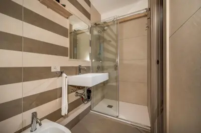 a bathroom with a sink and a shower at Villa Orizzonte in Scopello