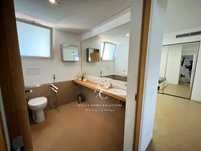 a bathroom with a toilet and a sink and mirrors at Oasi Elegante Piscina di Lusso - vista panoramica By Sicily Home Solutions in Alcamo