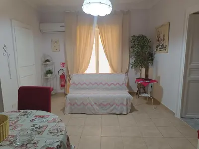 a living room with a couch and a window at Trip Rooms 2 in Palermo