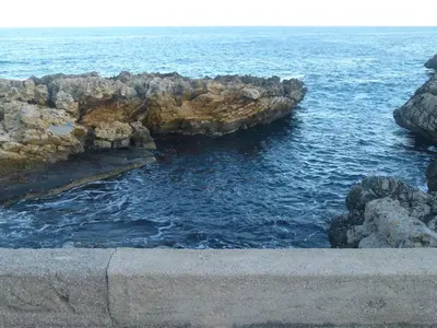 a rock formation in the water next to the ocean at Villino Toti e Silvana - a 50 mt dal mare in Carini