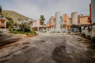 an empty parking lot in front of a building at Casa Vacanze Verdemare in Mondello