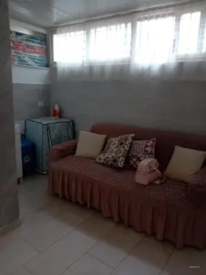 a living room with a couch with pillows at Dolce casa in Palermo