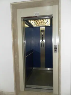 a elevator with a blue door in a building at Pompei in Castellammare del Golfo