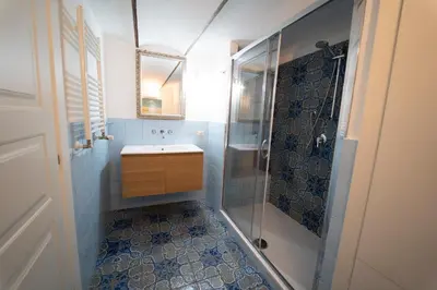 a bathroom with a sink and a shower at Il Tesoretto 1 in Palermo