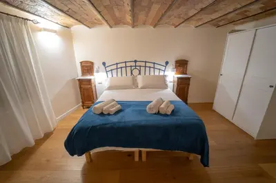 a bedroom with a bed with two towels on it at Il Tesoretto 2 in Palermo
