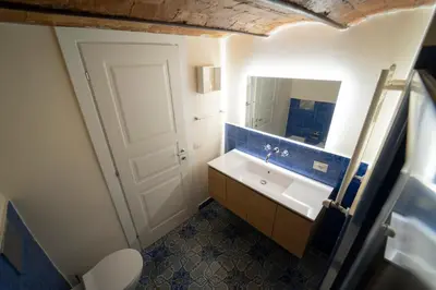 a bathroom with a sink and a mirror at Il Tesoretto 2 in Palermo