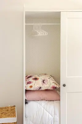 a bedroom with a bed inside of a closet at Villa Four by Sicily Travelling Villas in Scopello