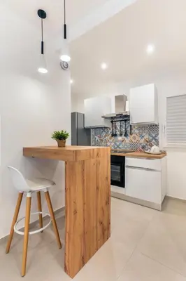 a kitchen with a wooden counter top in a room at Le Piccole Duse in Palermo