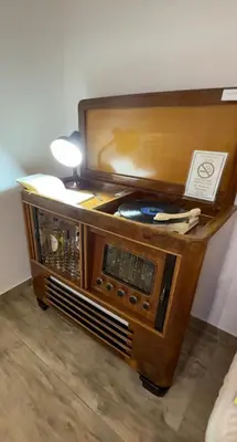 an old radio with a lamp on top of it at My Life in Palermo