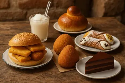 a table with plates of pastries and cakes and a glass of milk at My Life in Palermo