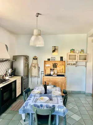 a kitchen with a table with plates on it at Villa Donna Toni in Carini
